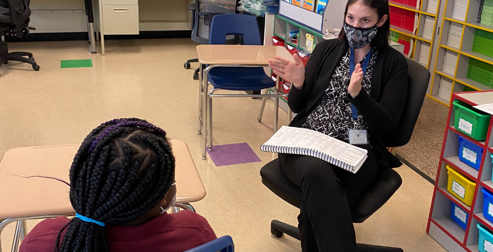 Syracuse Academy of Science and Citizenship elementary school teacher Mrs. Daniel helps a student with their reading and comprehension skills. Syracuse Academy of Science and Citizenship elementary school teacher Mrs. Daniel helps a student with their reading and comprehension skills.