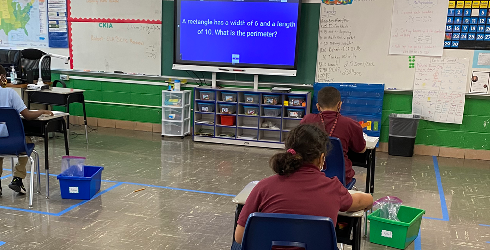 Syracuse Academy of Science and Citizenship students in room 4C played a Jeopardy style review game to prepare for an upcoming math exam. Syracuse Academy of Science and Citizenship students in room 4C played a Jeopardy style review game to prepare for an upcoming math exam.