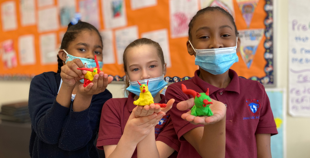Syracuse Academy of Science and Citizenship 3rd-grade students create animals out of modeling clay after determining and following their genetic code.